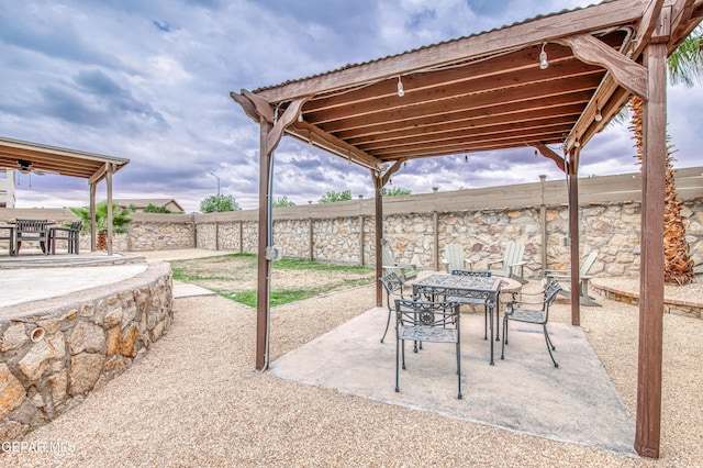 5705 Valley Lilac Ln, El Paso, TX 79932 - fenced backyard with a patio area and outdoor dining area