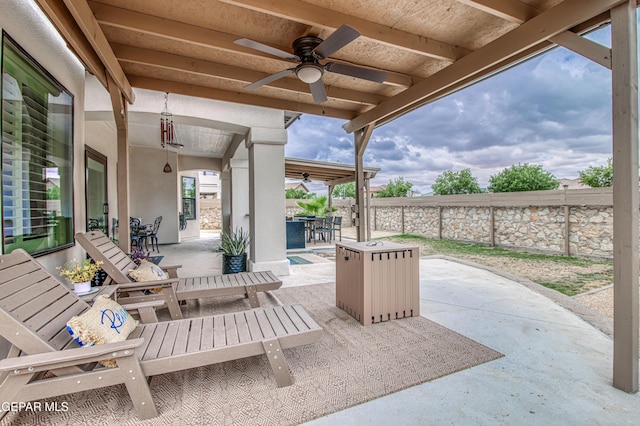 5705 Valley Lilac Ln, El Paso, TX 79932 - fenced backyard featuring ceiling fan, a patio area, and outdoor dining space