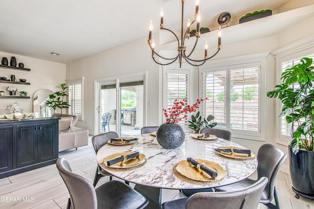 5705 Valley Lilac Ln, El Paso, TX 79932 - dining area featuring a chandelier and light wood-style flooring