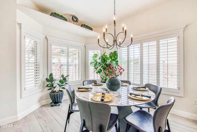 5705 Valley Lilac Ln, El Paso, TX 79932 - dining room featuring a chandelier and light wood-style floors
