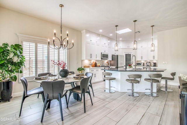 5705 Valley Lilac Ln, El Paso, TX 79932 - dining space featuring light wood-style flooring, a chandelier, and recessed lighting