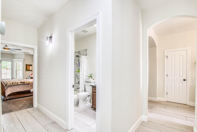 5705 Valley Lilac Ln, El Paso, TX 79932 - corridor featuring light wood-style floors and arched walkways