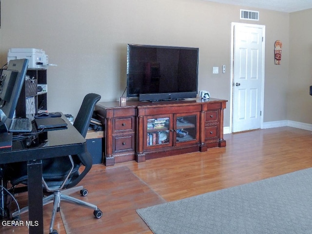 10945 Gary Player Dr, El Paso, TX 79935 - office featuring wood finished floors and baseboards