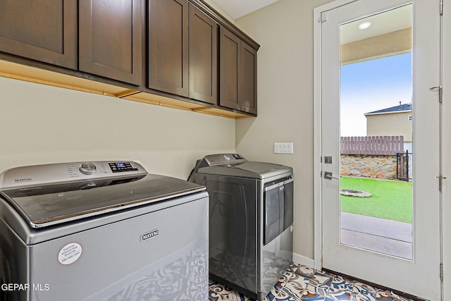 14753 Charles Foster Ave, El Paso, TX 79938 - laundry room with cabinet space, washer and clothes dryer, and healthy amount of natural light