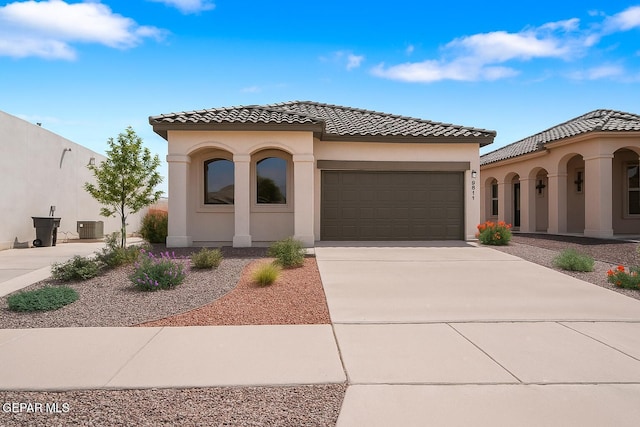 257 Farnborough St, El Paso, TX 79928 - mediterranean / spanish home with a garage, driveway, a tile roof, and stucco siding