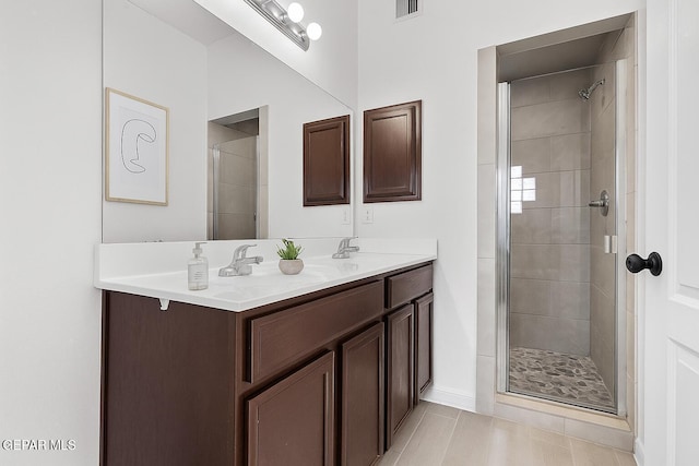 257 Farnborough St, El Paso, TX 79928 - bathroom with double vanity, a shower stall, and tile patterned flooring