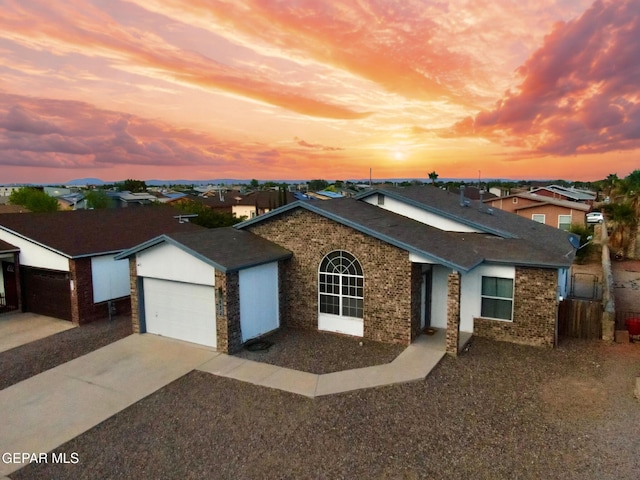 632 Manzanilla Pl, El Paso, TX 79928 - ranch-style house featuring concrete driveway, a garage, roof with shingles, and a residential view