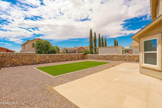 2629 Snowy Rock Pl, El Paso, TX 79938 - fenced backyard with a patio