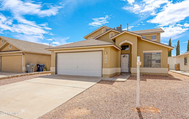 2629 Snowy Rock Pl, El Paso, TX 79938 - view of front of property featuring stucco siding, an attached garage, and concrete driveway