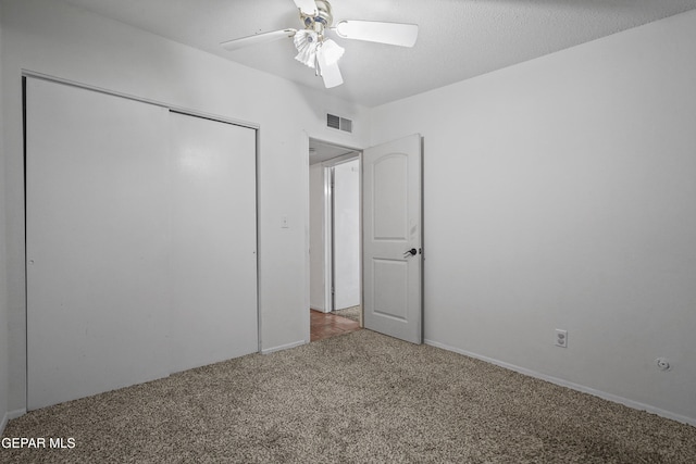 10106 Mercedes St, El Paso, TX 79924 - unfurnished bedroom with carpet floors, a closet, and a ceiling fan