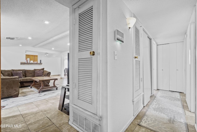 10106 Mercedes St, El Paso, TX 79924 - hallway featuring a textured ceiling, recessed lighting, and tile patterned flooring