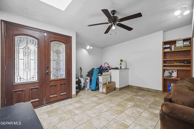 10106 Mercedes St, El Paso, TX 79924 - foyer entrance featuring a ceiling fan and a textured ceiling