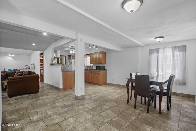 10106 Mercedes St, El Paso, TX 79924 - dining room featuring a textured ceiling and ceiling fan