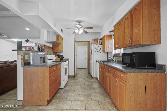 10106 Mercedes St, El Paso, TX 79924 - kitchen with white appliances, ceiling fan, dark countertops, brown cabinetry, and recessed lighting