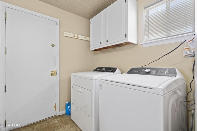10106 Mercedes St, El Paso, TX 79924 - laundry room featuring cabinet space, washer and dryer, and a textured ceiling