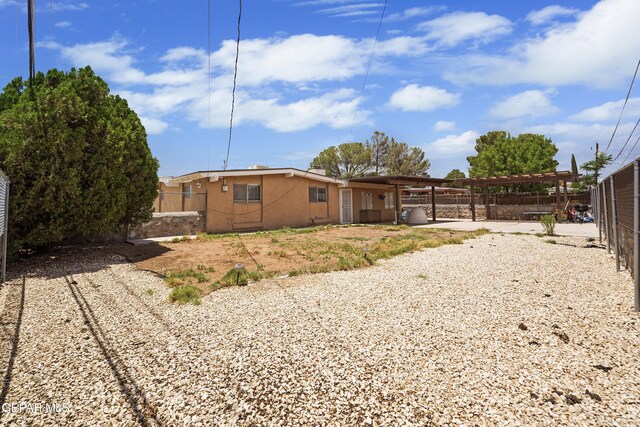 10106 Mercedes St, El Paso, TX 79924 - back of house with a fenced backyard and stucco siding