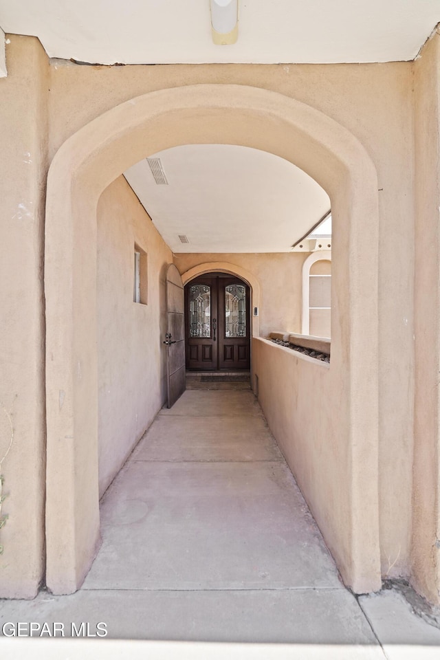 10106 Mercedes St, El Paso, TX 79924 - hall featuring arched walkways and french doors