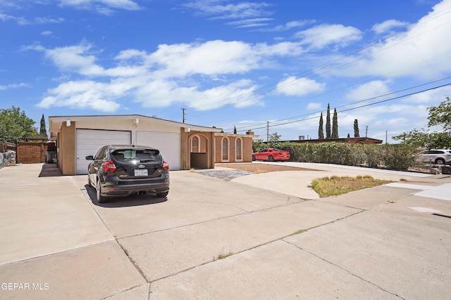 10106 Mercedes St, El Paso, TX 79924 - view of front of house featuring driveway and an attached garage