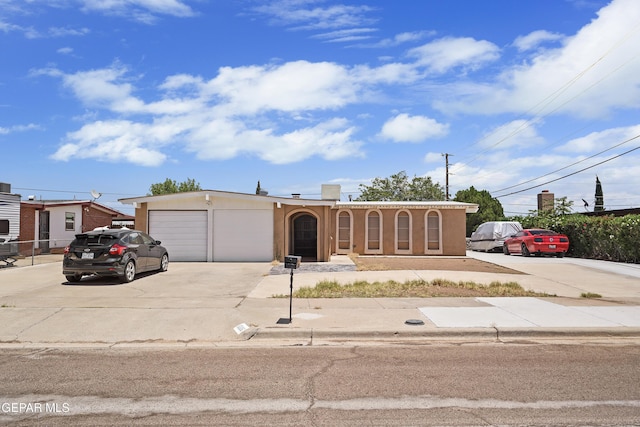 10106 Mercedes St, El Paso, TX 79924 - view of front facade featuring concrete driveway, stucco siding, and an attached garage