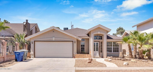 11651 Great Spirit Cir, El Paso, TX 79936 - ranch-style home with an attached garage, driveway, and stucco siding