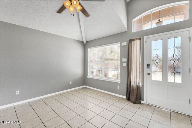 11651 Great Spirit Cir, El Paso, TX 79936 - entryway featuring a ceiling fan, light tile patterned floors, high vaulted ceiling, and a textured ceiling