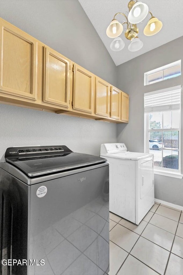 11651 Great Spirit Cir, El Paso, TX 79936 - washroom with washing machine and dryer, cabinet space, light tile patterned flooring, and a chandelier
