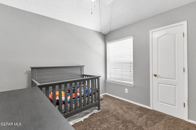 11651 Great Spirit Cir, El Paso, TX 79936 - bedroom with a textured ceiling, carpet floors, and a crib