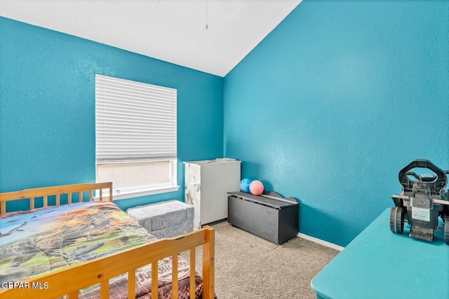11651 Great Spirit Cir, El Paso, TX 79936 - bedroom featuring a textured wall, carpet floors, and lofted ceiling