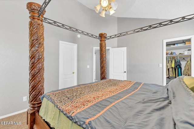 11651 Great Spirit Cir, El Paso, TX 79936 - bedroom featuring vaulted ceiling, carpet floors, ceiling fan, and a spacious closet