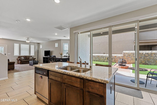 2116 Tim Foster St, El Paso, TX 79938 - kitchen featuring dishwasher, a ceiling fan, light stone counters, recessed lighting, and a kitchen island with sink
