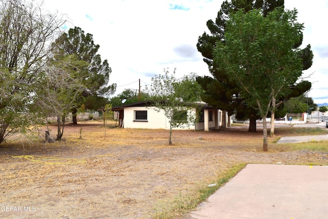 7556 N Loop Dr, El Paso, TX 79915 - view of front of house featuring stucco siding