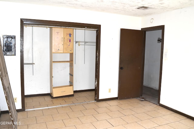 7556 N Loop Dr, El Paso, TX 79915 - unfurnished bedroom with a closet and baseboards