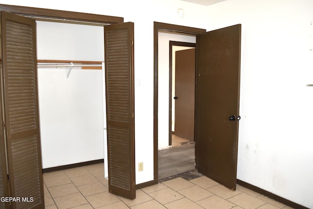 7556 N Loop Dr, El Paso, TX 79915 - unfurnished bedroom with a closet and light tile patterned floors