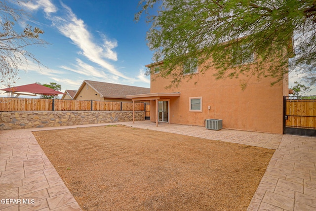 12308 Sombra Grande Dr, El Paso, TX 79938 - rear view of house featuring stucco siding, a patio, and a fenced backyard