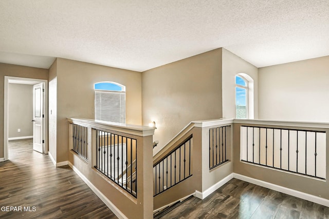 12308 Sombra Grande Dr, El Paso, TX 79938 - stairway featuring wood finished floors and a textured ceiling