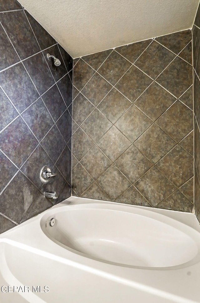 12308 Sombra Grande Dr, El Paso, TX 79938 - full bathroom with a textured ceiling and bathing tub / shower combination