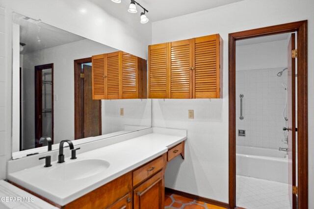 11204 Bob Mitchell Dr, El Paso, TX 79936 - bathroom with vanity, tub / shower combination, and tile patterned floors
