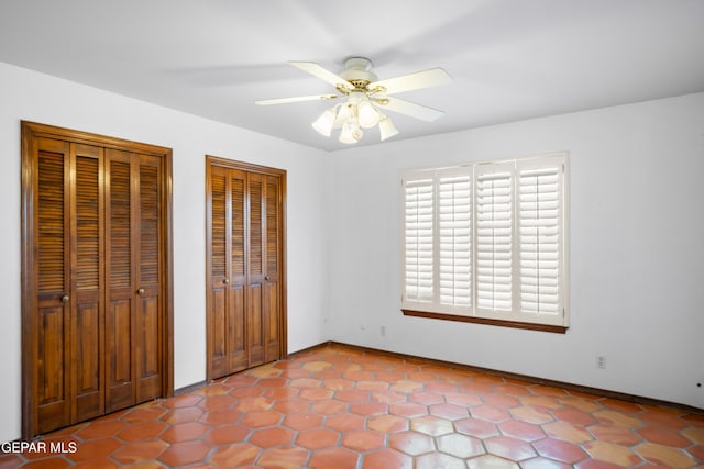 11204 Bob Mitchell Dr, El Paso, TX 79936 - unfurnished bedroom featuring two closets and ceiling fan