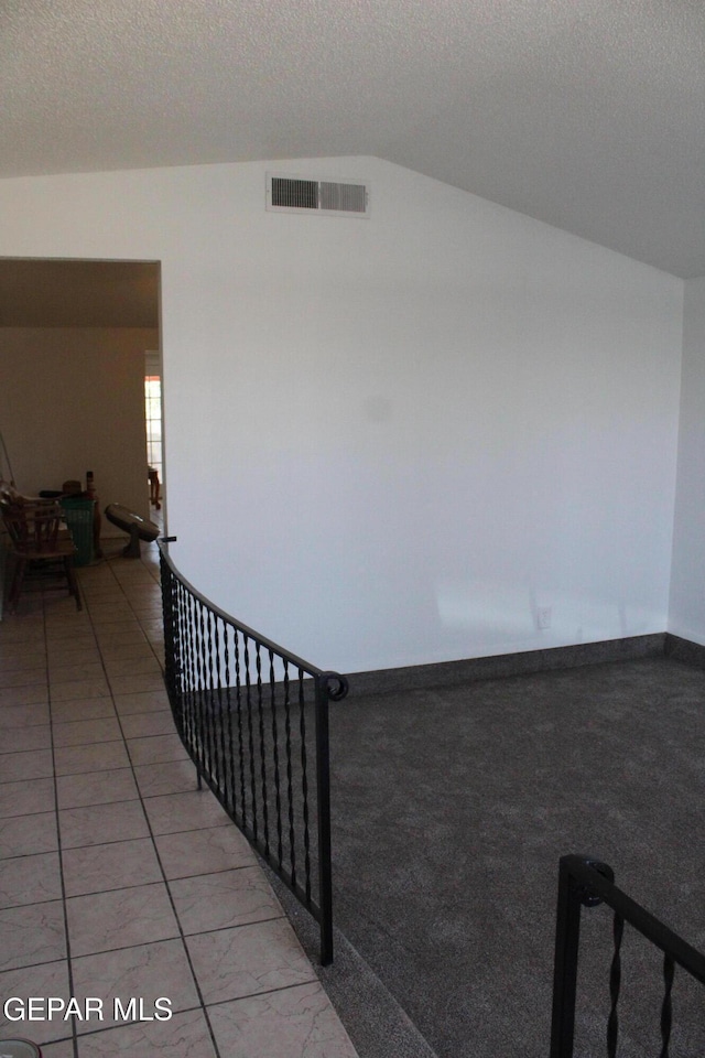5124 Edmonton Ave, El Paso, TX 79924 - hall featuring lofted ceiling and a textured ceiling