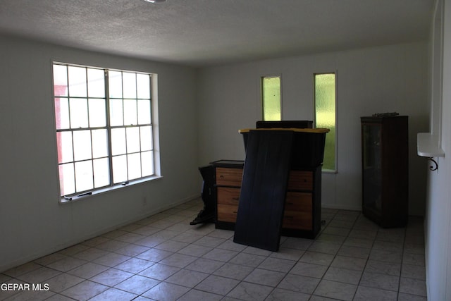 5124 Edmonton Ave, El Paso, TX 79924 - unfurnished office with light tile patterned floors and a textured ceiling