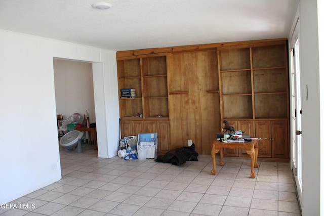 5124 Edmonton Ave, El Paso, TX 79924 - unfurnished office with built in shelves and light tile patterned floors