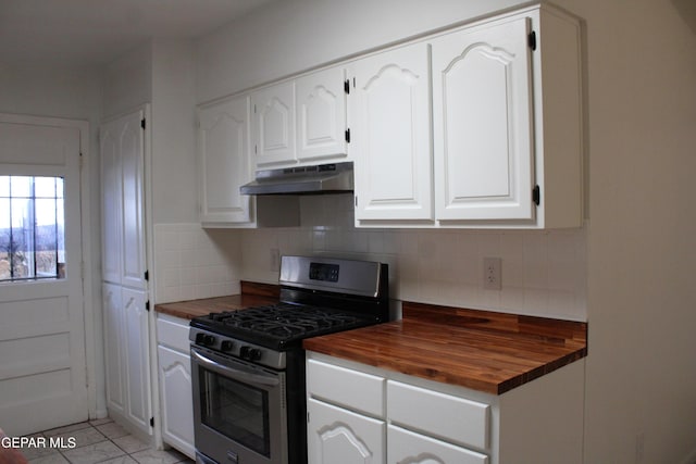 5124 Edmonton Ave, El Paso, TX 79924 - kitchen with stainless steel range with gas stovetop, butcher block countertops, under cabinet range hood, and white cabinetry