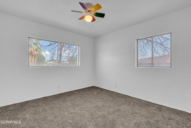 6033 Isabella Dr, El Paso, TX 79912 - unfurnished room featuring carpet floors, healthy amount of natural light, and a ceiling fan