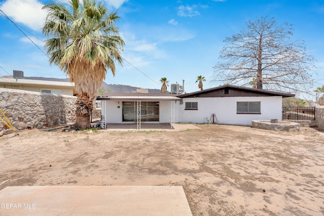 6033 Isabella Dr, El Paso, TX 79912 - rear view of property featuring a patio area and stucco siding