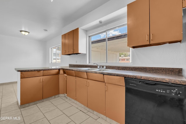 6033 Isabella Dr, El Paso, TX 79912 - kitchen with black dishwasher, dark countertops, a peninsula, and light tile patterned flooring