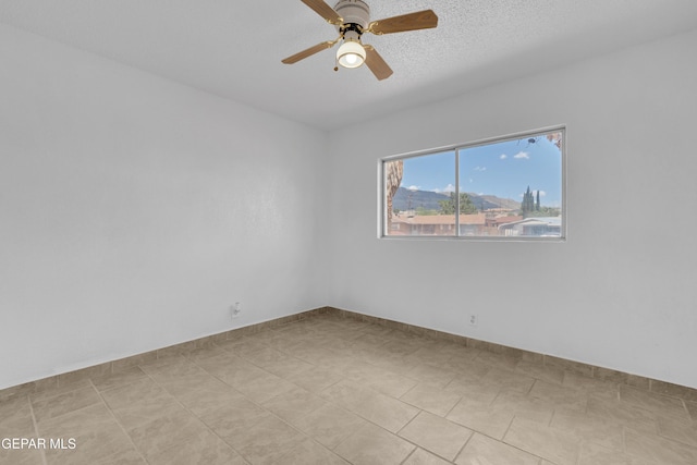 6033 Isabella Dr, El Paso, TX 79912 - unfurnished room with ceiling fan and a textured ceiling