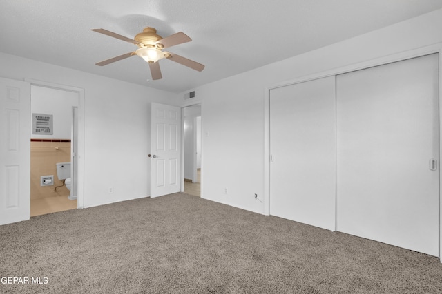 6033 Isabella Dr, El Paso, TX 79912 - unfurnished bedroom with carpet floors, a closet, ensuite bathroom, and a ceiling fan