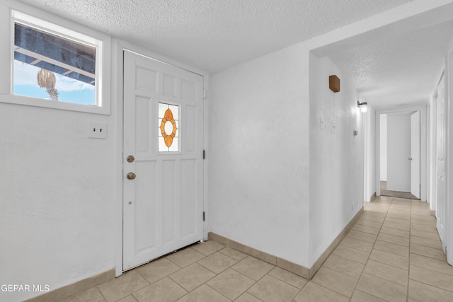 6033 Isabella Dr, El Paso, TX 79912 - foyer with a textured ceiling and light tile patterned floors