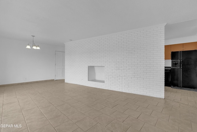 6033 Isabella Dr, El Paso, TX 79912 - unfurnished living room featuring a chandelier, light tile patterned floors, and brick wall