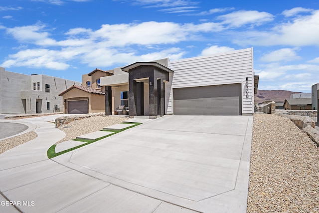 2308 Enchanted Quail, El Paso, TX 79911 - contemporary house featuring driveway, a garage, and stucco siding